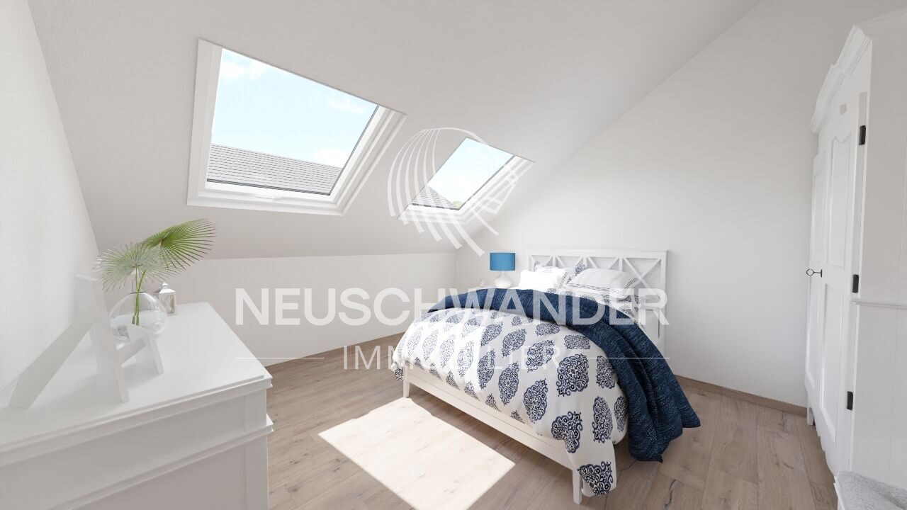 une petite chambre avec un lit blanc et une lucarne