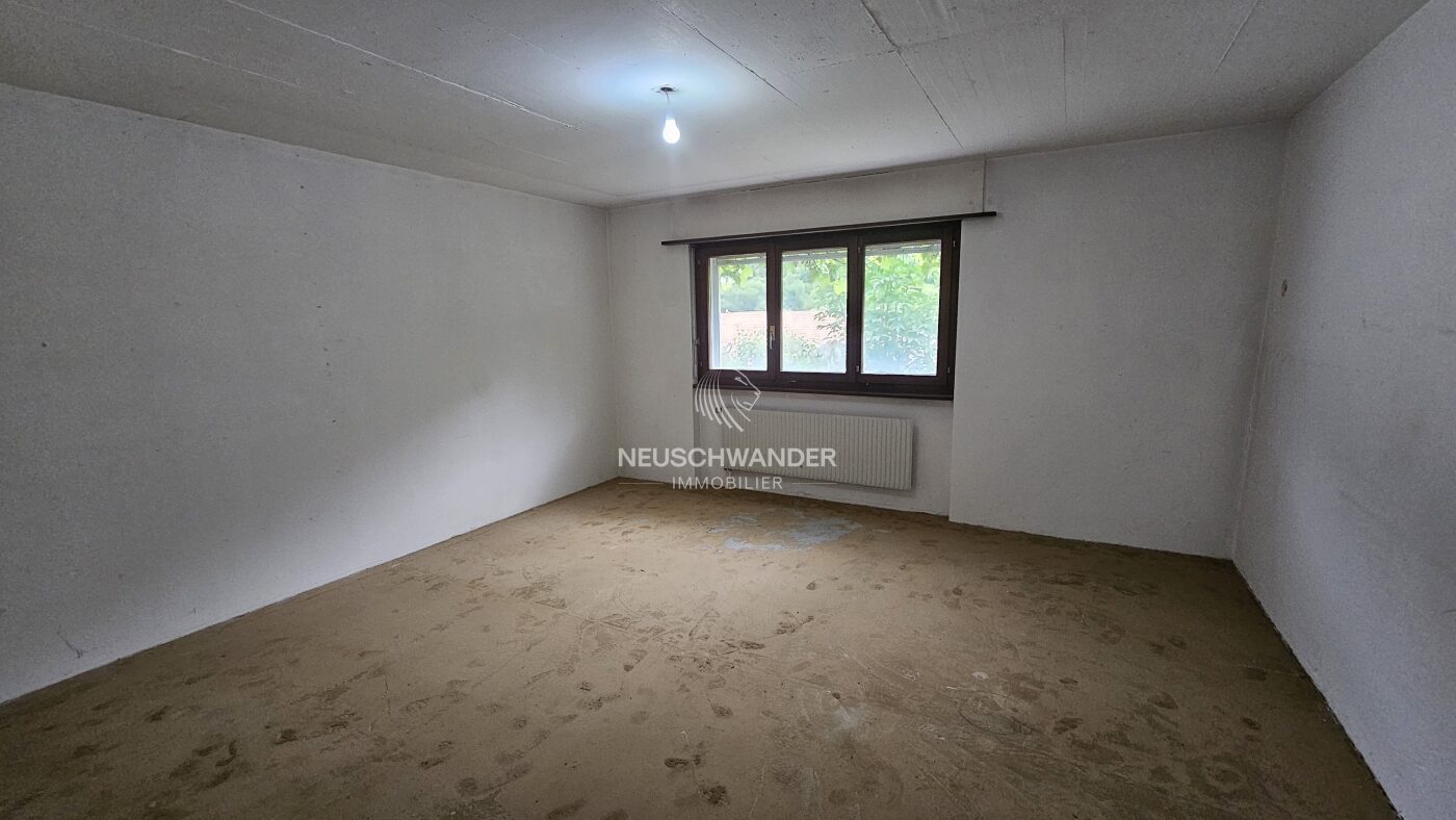 Chambre au rez-inférieur